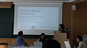 Photo of Öykü presenting research.
